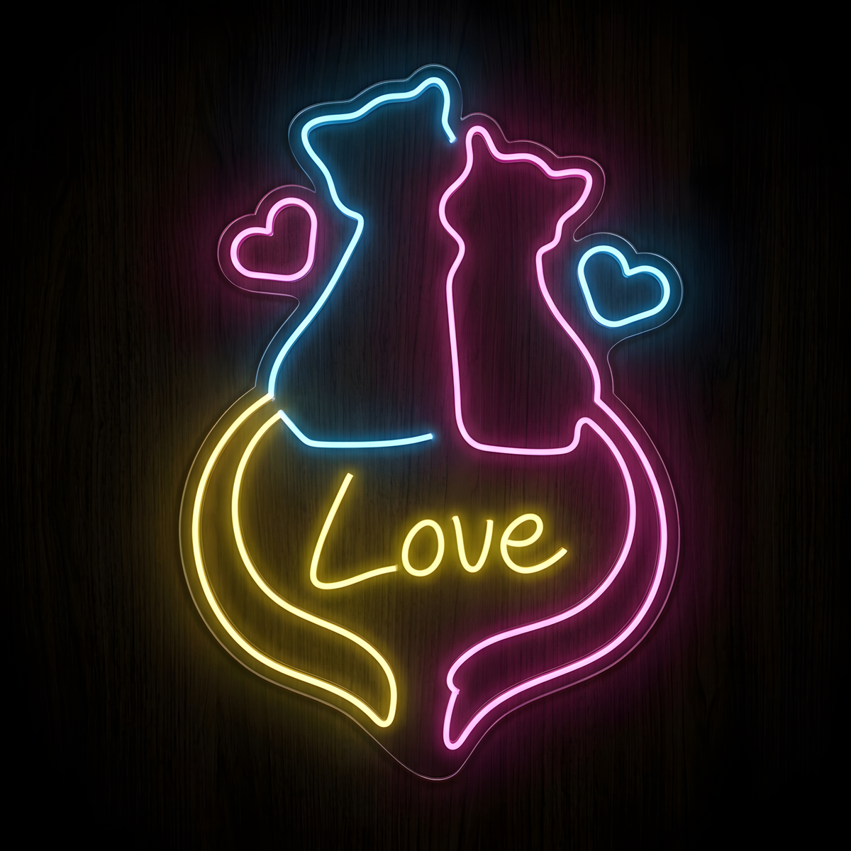 Cats in Love LED Neon Sign featuring two sitting cat silhouettes in blue and pink with intertwined yellow and pink tails, glowing heart accents, and the word Love, displayed on clear acrylic against a dark wood background for cat lovers, pet stores, cat cafés, veterinary clinics, and pet-themed home decor.