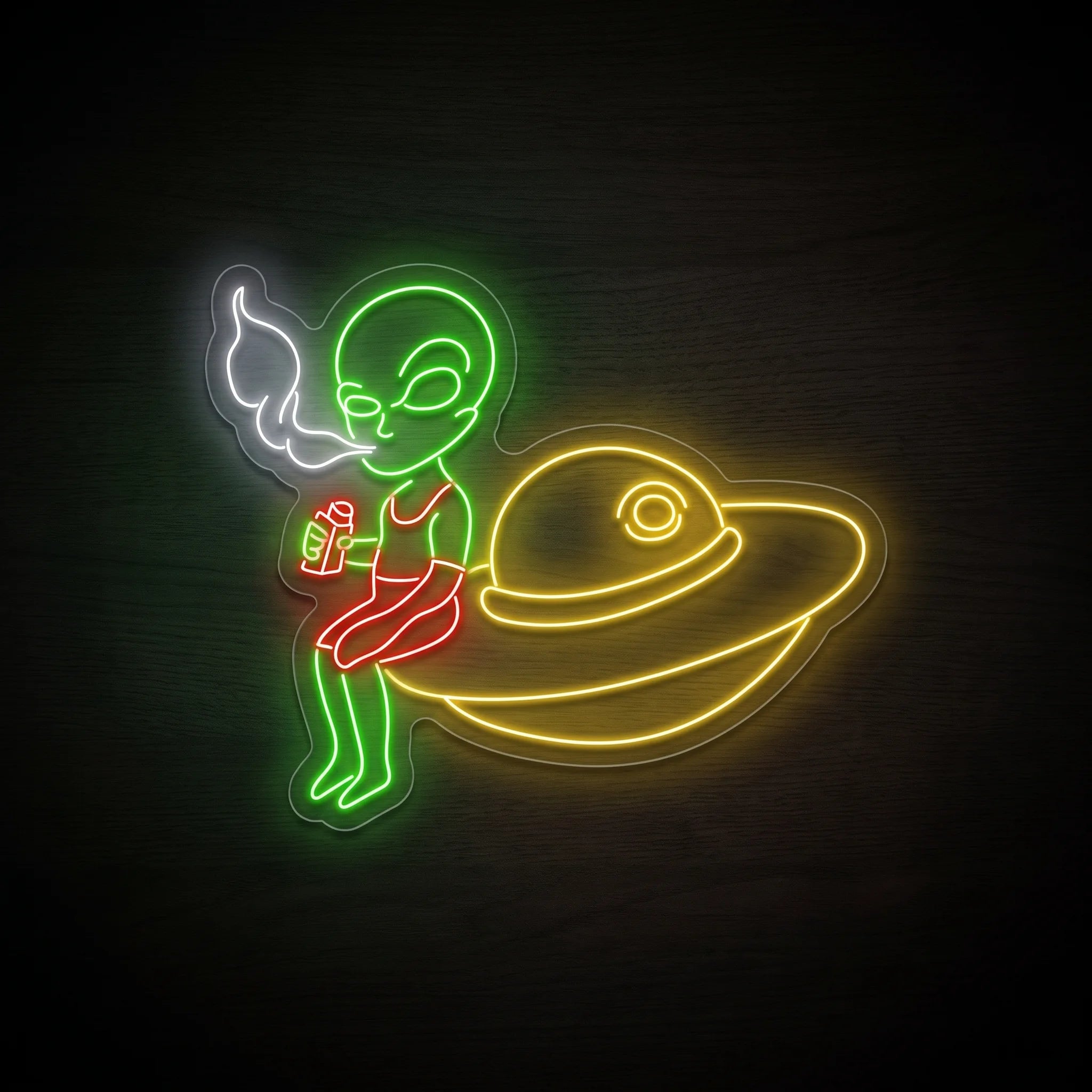 Alien Saucer Puff LED neon sign on clear acrylic backing featuring a green alien, golden flying saucer, white smoke, and red accents for recreational wall décor.