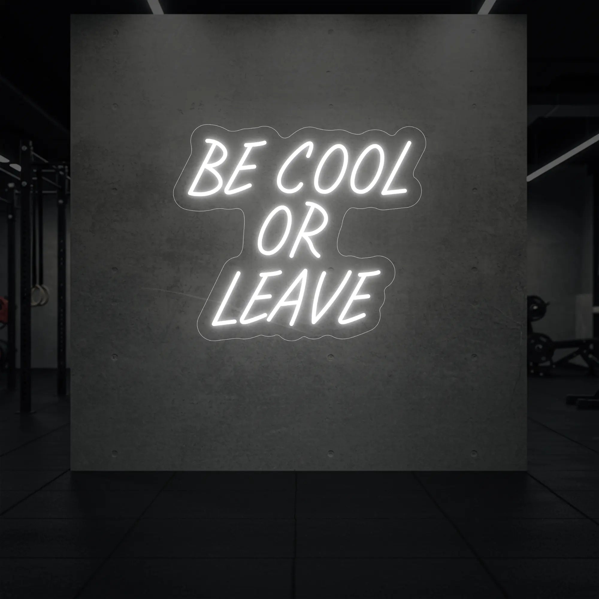 'Be Cool or Leave' neon sign glowing in cool white against a styled interior wall.