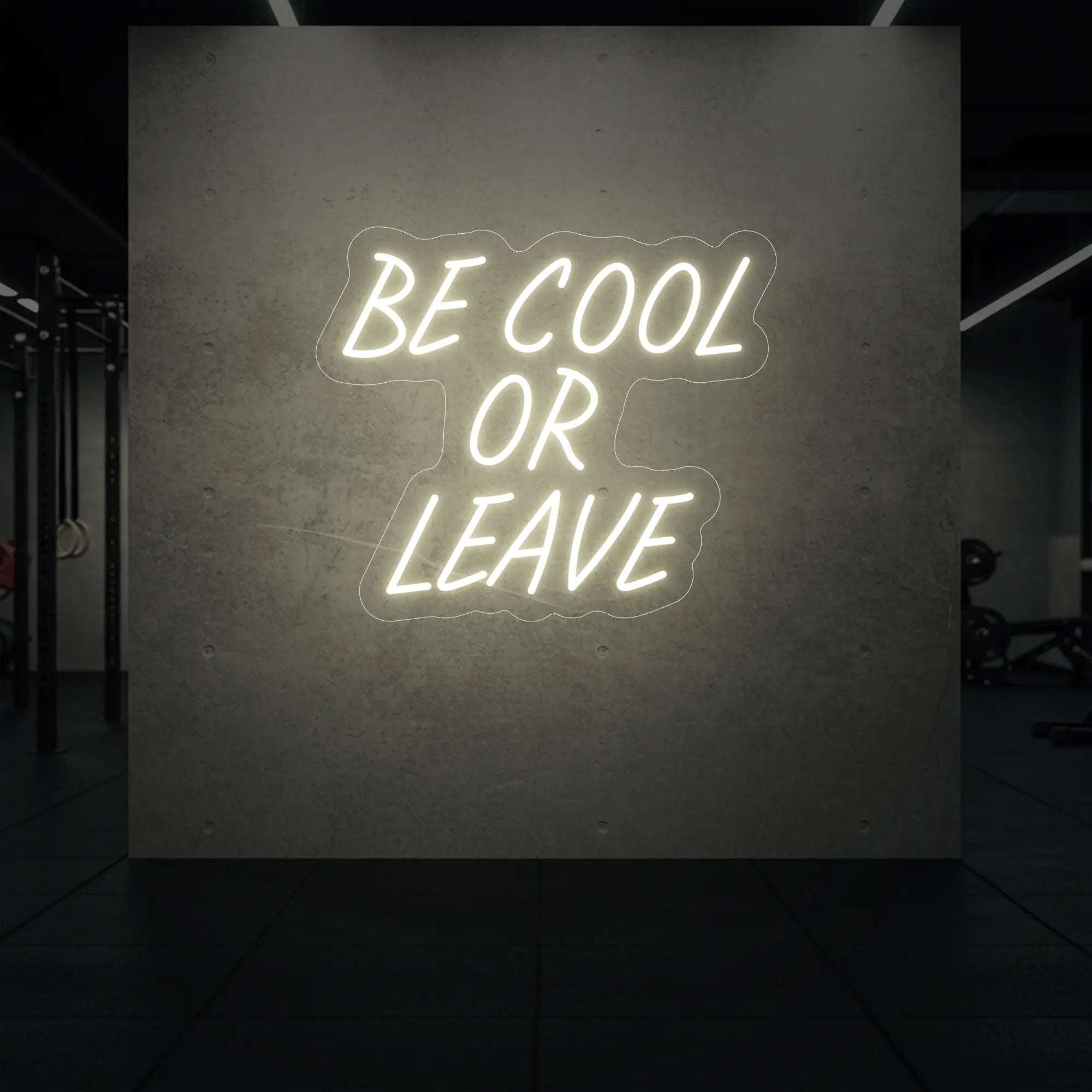 'Be Cool or Leave' neon sign glowing in warm white against a styled interior wall.