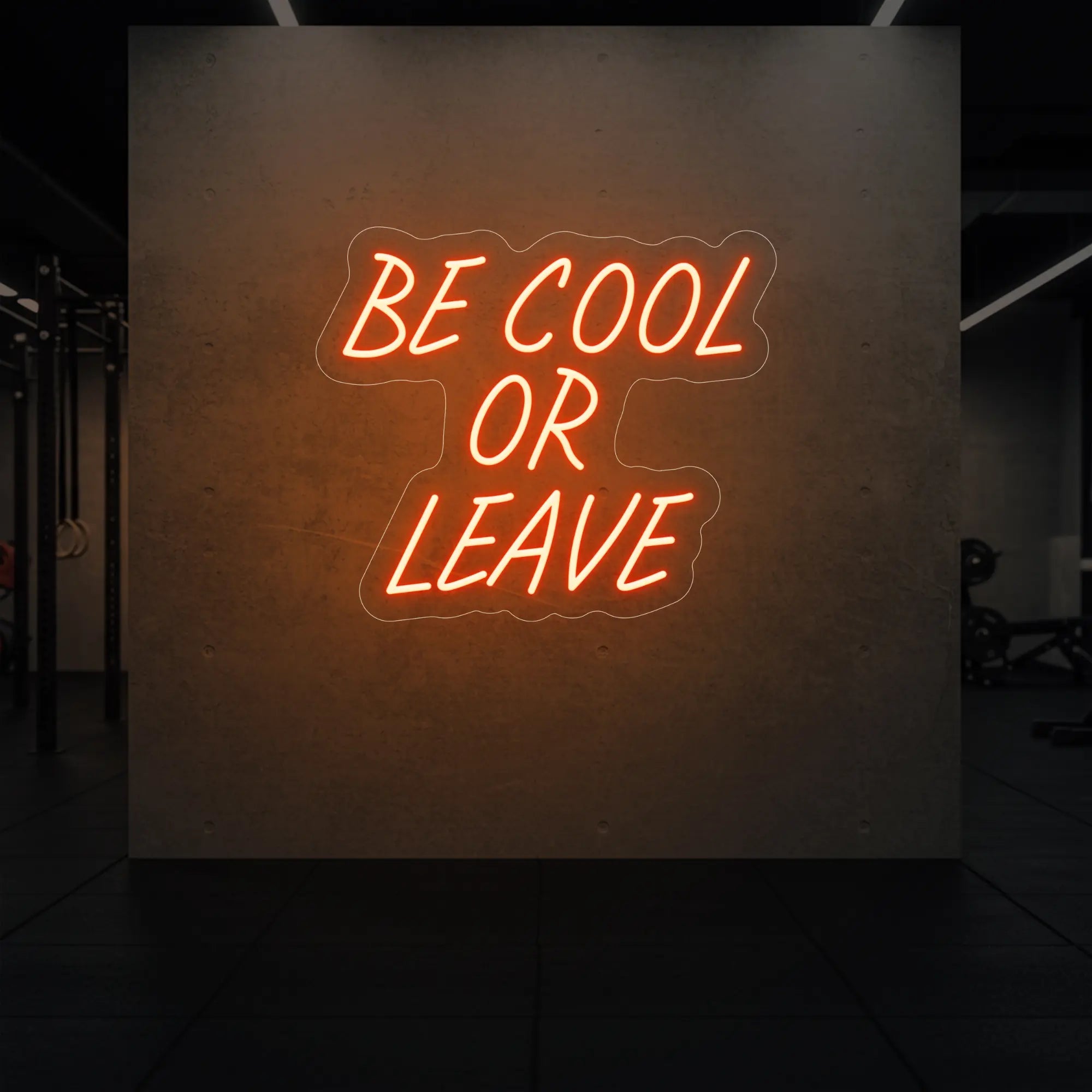 'Be Cool or Leave' neon sign glowing in golden yellow against a styled interior wall.