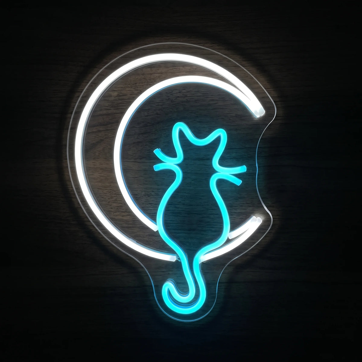 Blue cat silhouette and white crescent moon LED neon sign on clear acrylic backing.