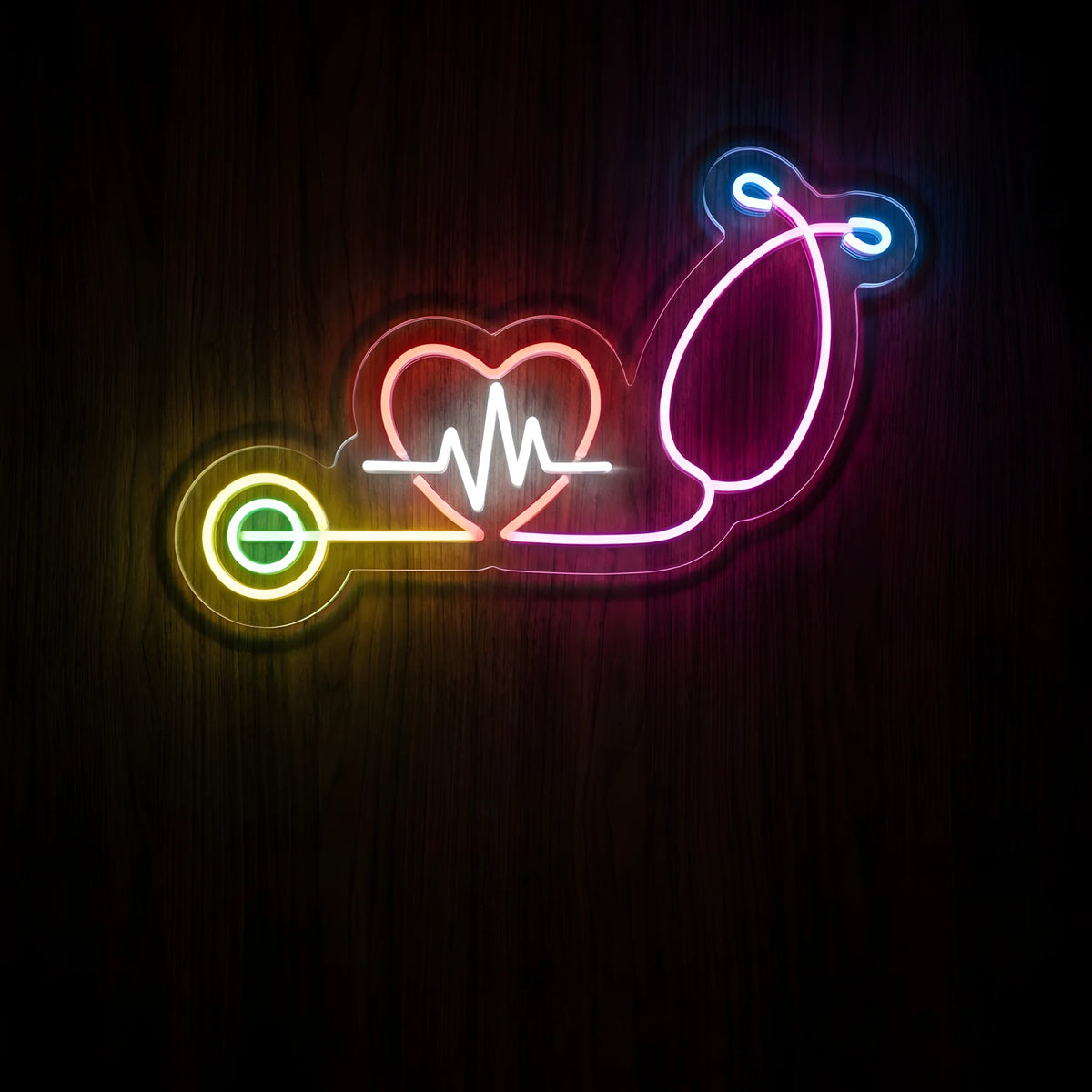 Colorful Stethoscope Heart LED Neon Sign featuring a multicolored stethoscope, glowing red heart, and white heartbeat line in vibrant pink, yellow, green, and blue neon on clear acrylic backing.