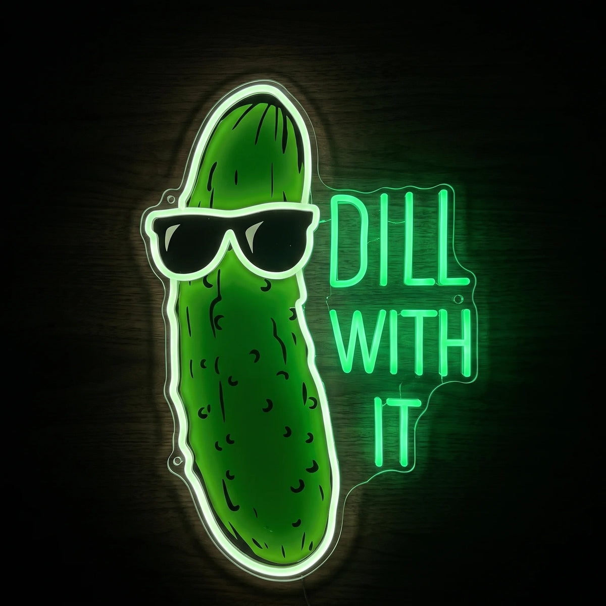 Dill With It pickle LED neon sign with green pickle artwork, black sunglasses, green lettering, and acrylic backing.