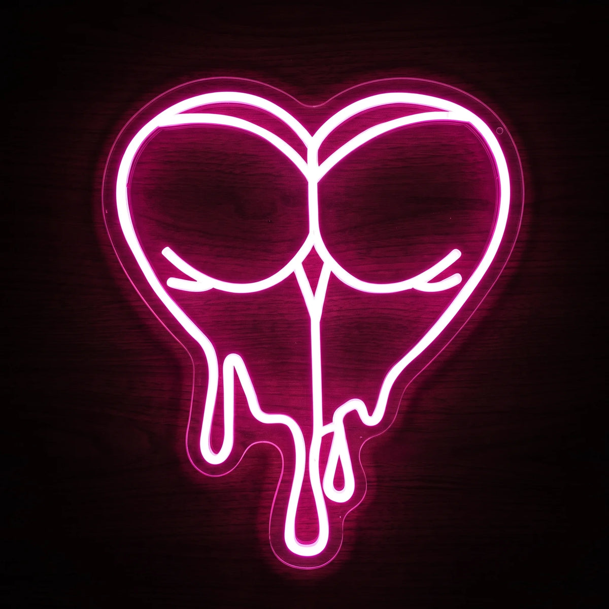 Dripping heart LED neon sign with vivid pink illumination on clear acrylic backing.