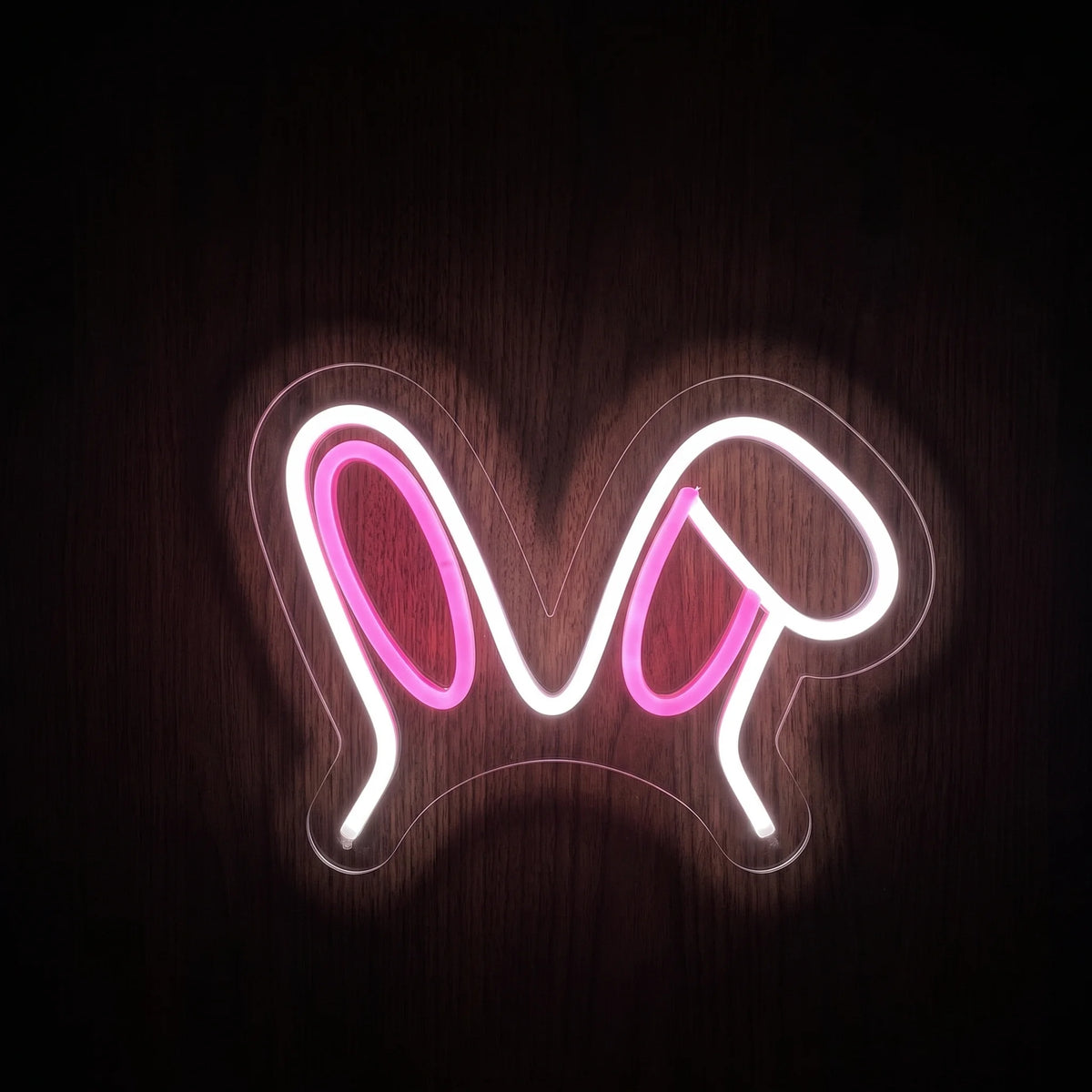 Floppy Bunny Ears LED neon sign featuring a cute white and pink bunny ear design mounted on clear acrylic backing.