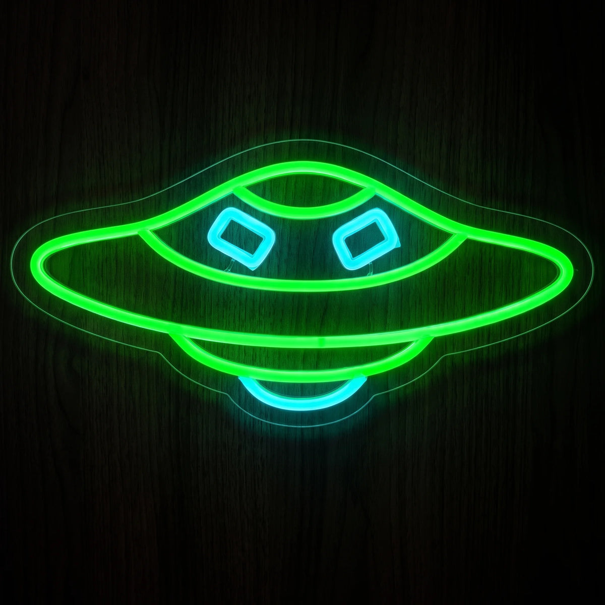 Flying Saucer UFO LED Neon Sign with vibrant green saucer outline and bright blue details on clear acrylic backing.