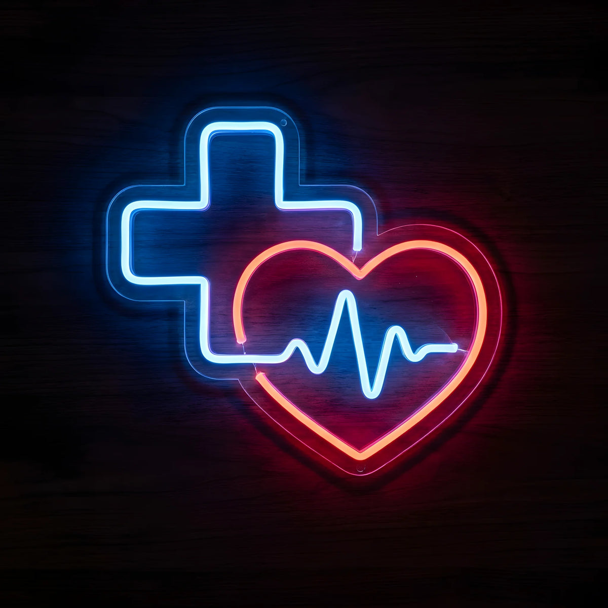Healthcare Heart & Cross LED Neon Sign featuring a glowing blue medical cross, red heart outline, and blue heartbeat line on clear cut-to-shape acrylic backing against a dark wooden wall.