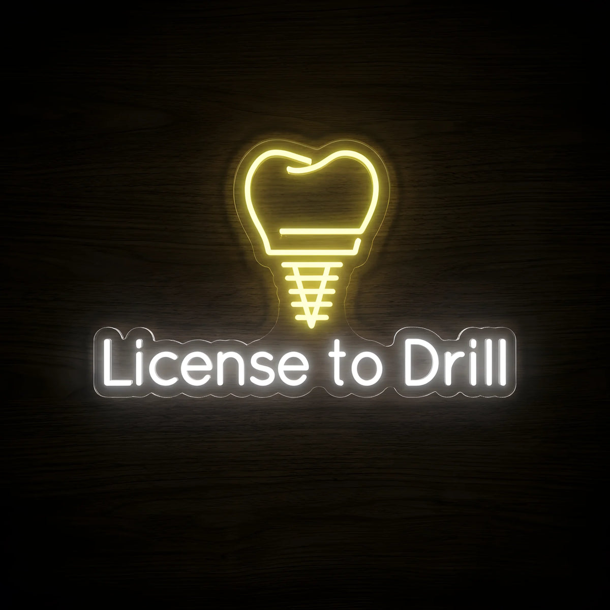 License to Drill LED neon sign featuring a golden-yellow dental implant screw shaped like a tooth above cool white License to Drill lettering on clear acrylic backing for dental clinic and dentist office wall decor.