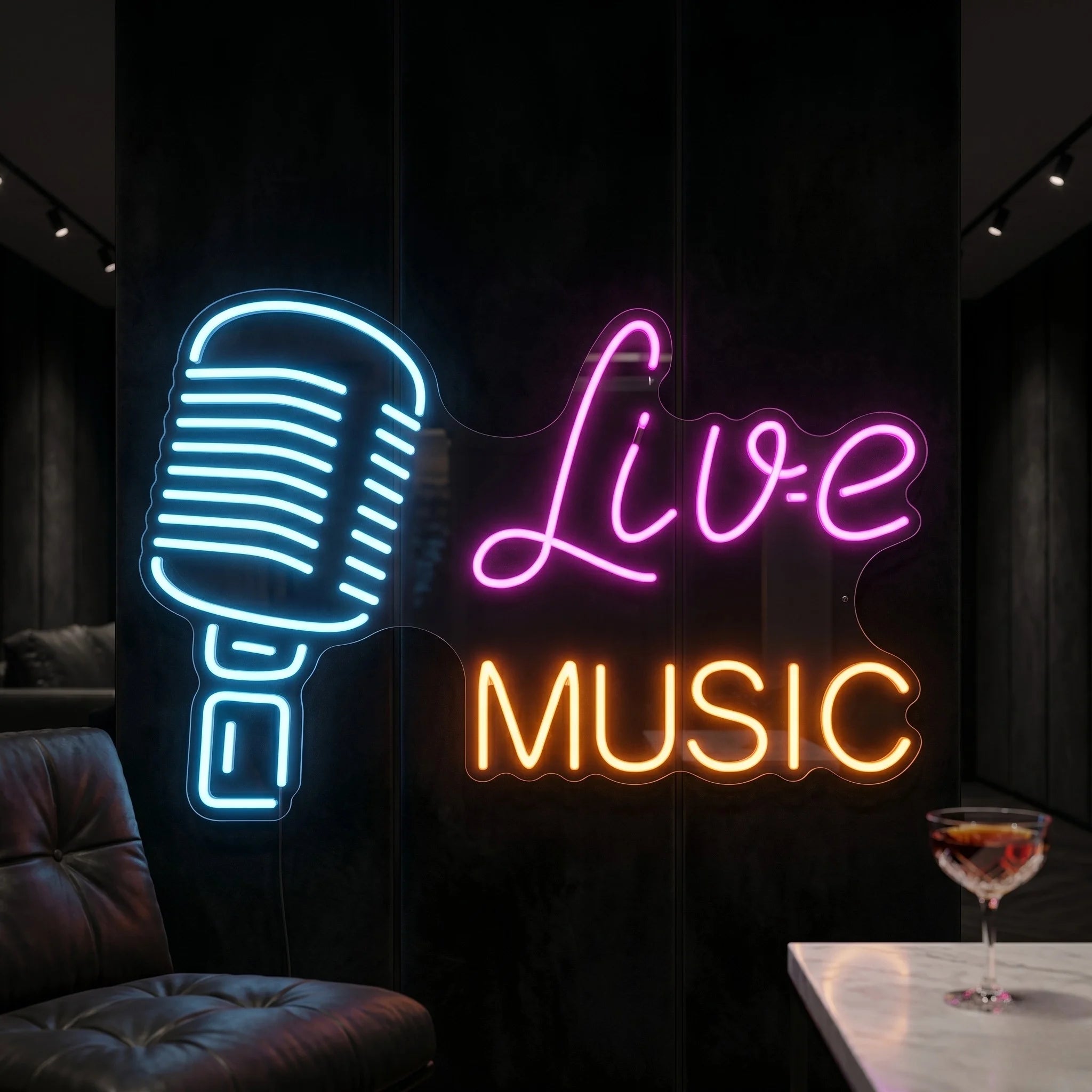 Photo of the 'Live Music' neon sign glowing in multi-color against a styled interior wall.
