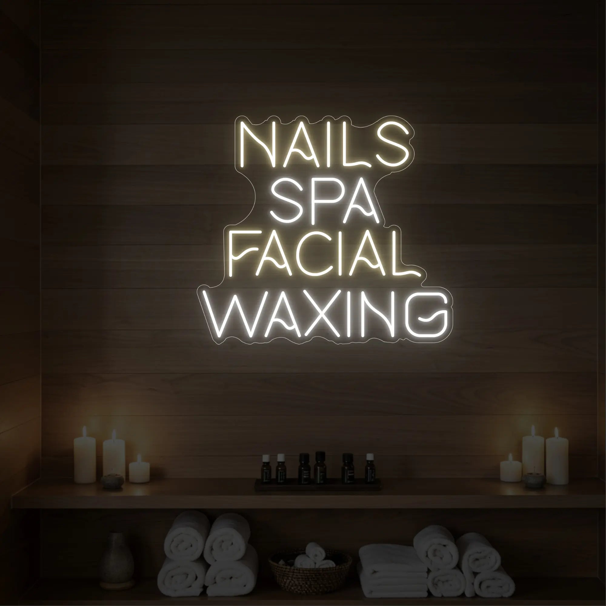 Photo of the 'Nails Spa Facial Waxing' neon sign glowing in warm white against a styled interior wall.