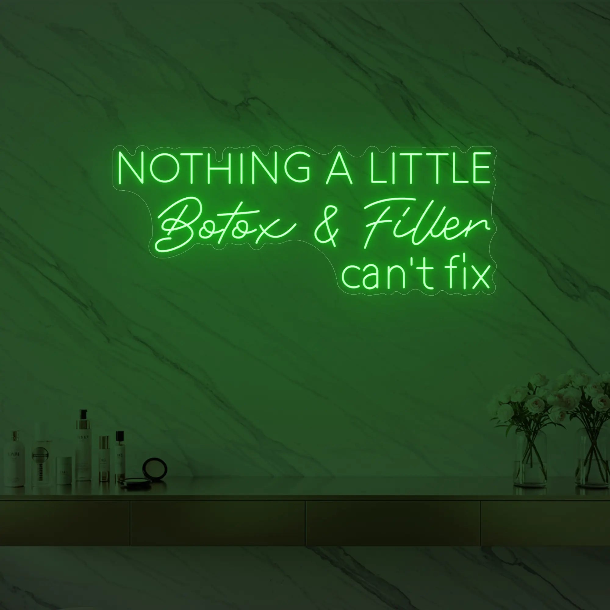 Photo of the 'Nothing a Little Botox & Filler Can’t Fix' neon sign glowing in green against a styled interior wall.