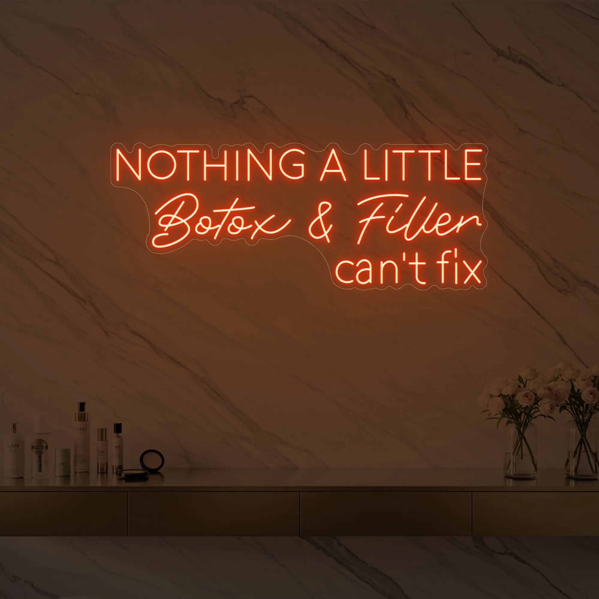 Photo of the 'Nothing a Little Botox & Filler Can’t Fix' neon sign glowing in golden yellow against a styled interior wall.