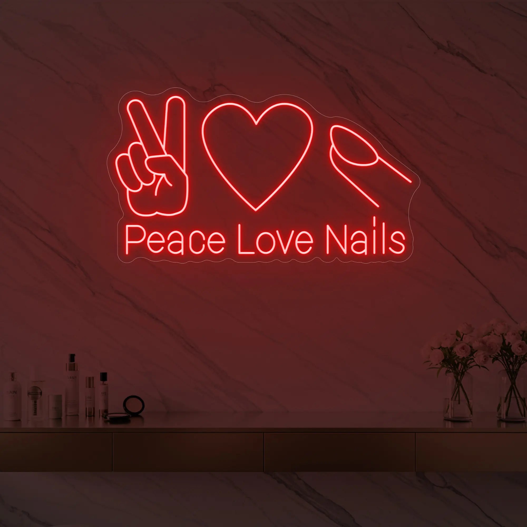 Photo of the 'Peace Love Nails' neon sign glowing in red against a styled interior wall.