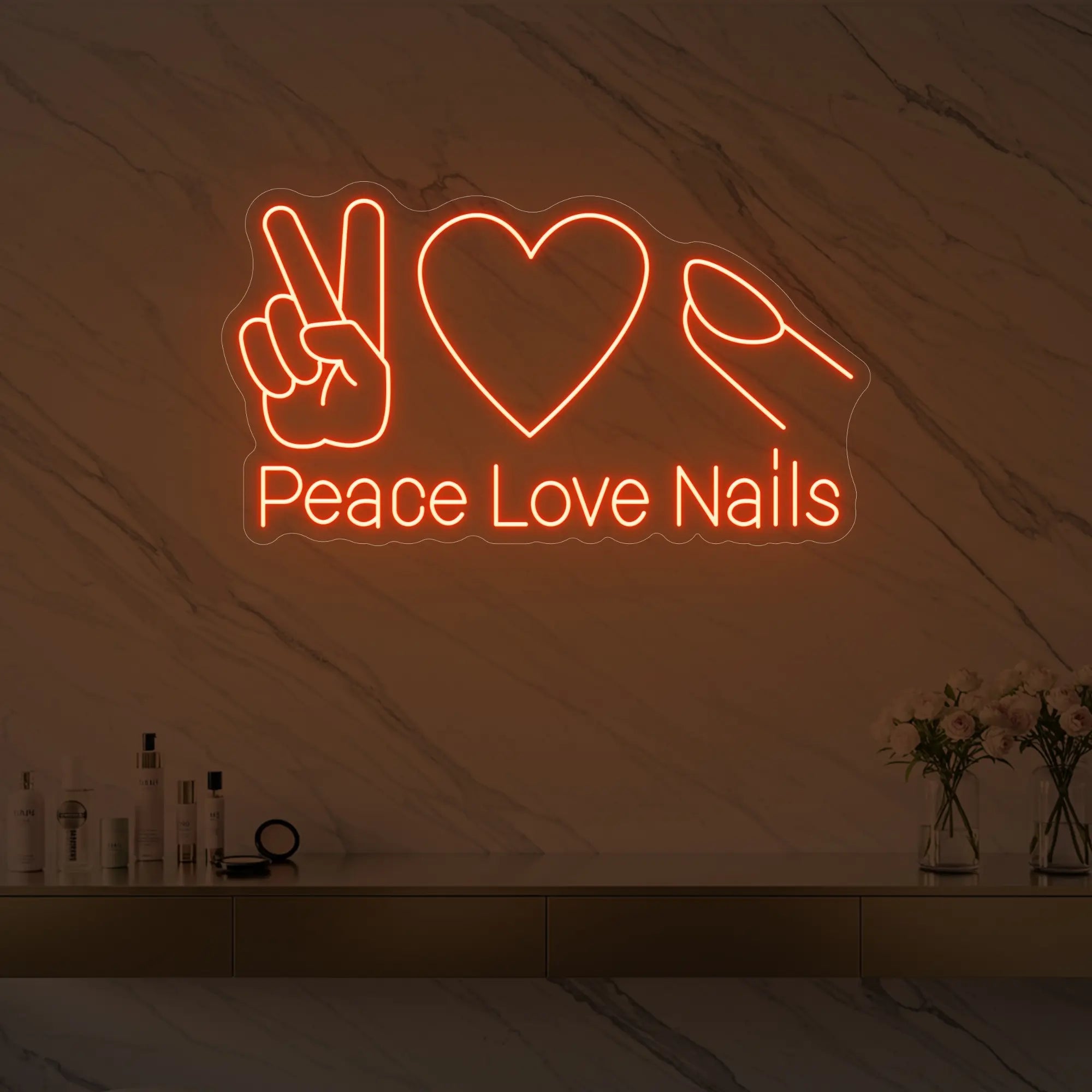Photo of the 'Peace Love Nails' neon sign glowing in golden yellow against a styled interior wall.