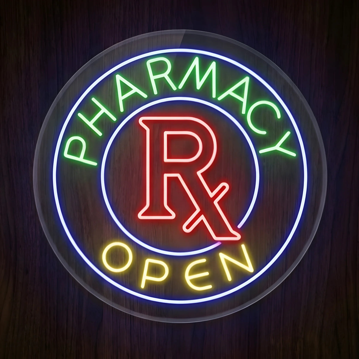 Pharmacy Rx Open LED Neon Sign featuring green PHARMACY text, red Rx symbol, yellow OPEN lettering, and a glowing blue circular border on clear round acrylic against a dark wooden wall.
