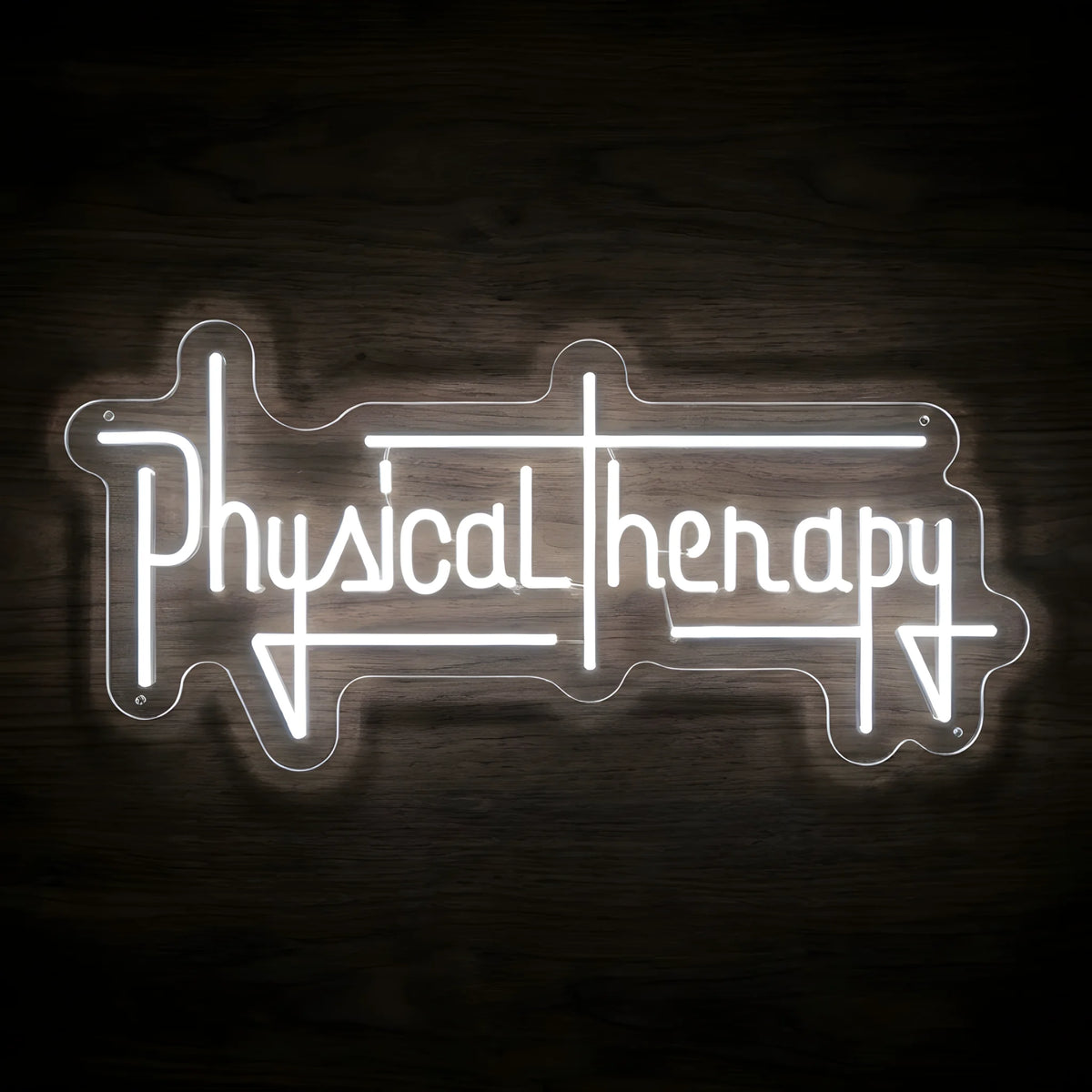 Physical Therapy Barbell LED Neon Sign featuring bright white stylized lettering with geometric line accents on clear cut-to-shape acrylic against a dark wooden wall.