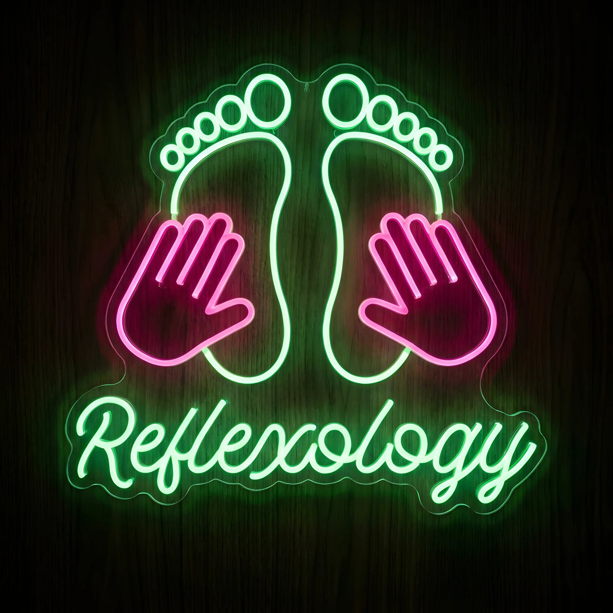 Reflexology Footprints LED Neon Sign featuring green glowing footprints, pink massage hands, and green Reflexology script lettering on clear acrylic backing against a dark wooden wall.