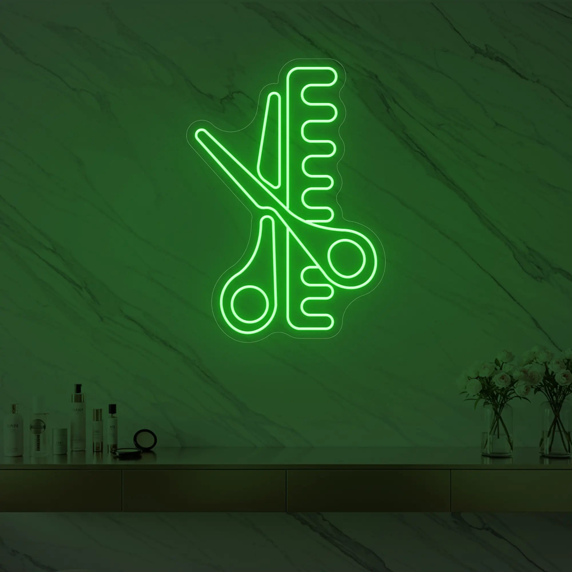 Photo of the 'Scissors and Comb' neon sign glowing in green against a styled interior wall.