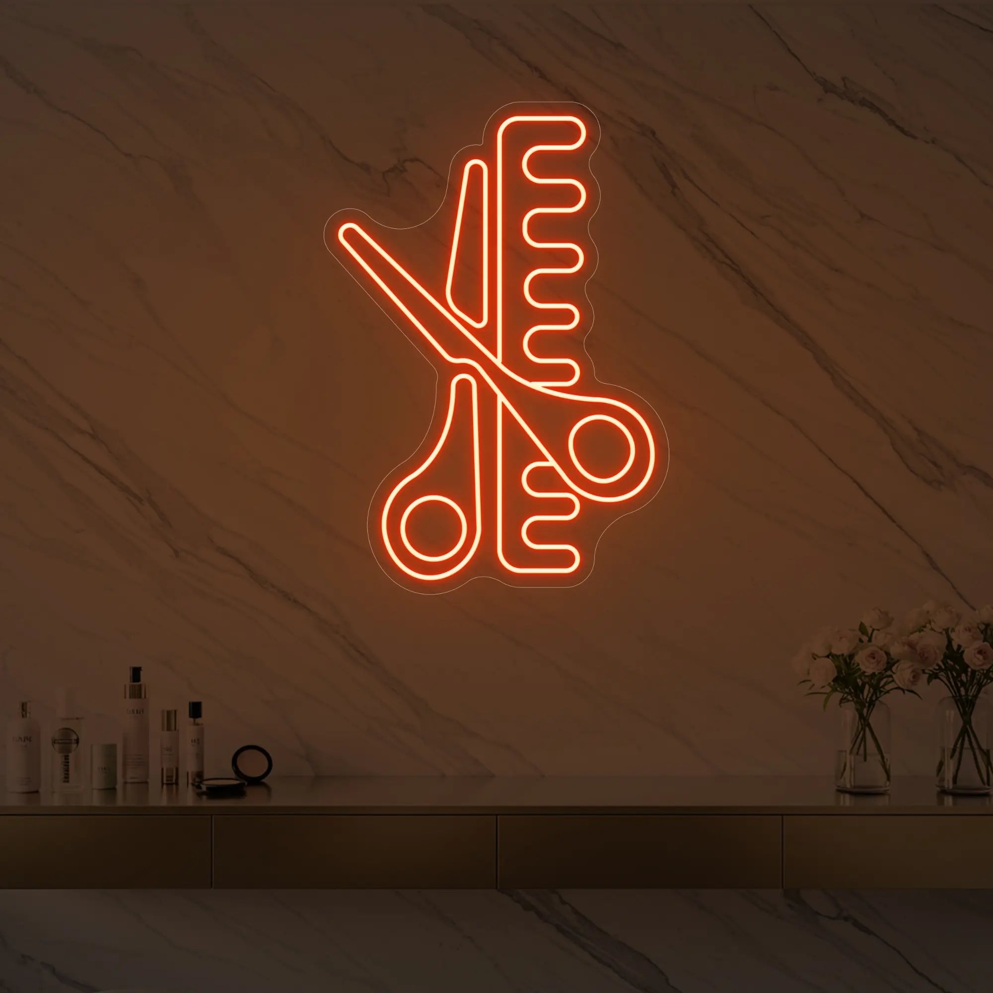 Photo of the 'Scissors and Comb' neon sign glowing in golden yellow against a styled interior wall.
