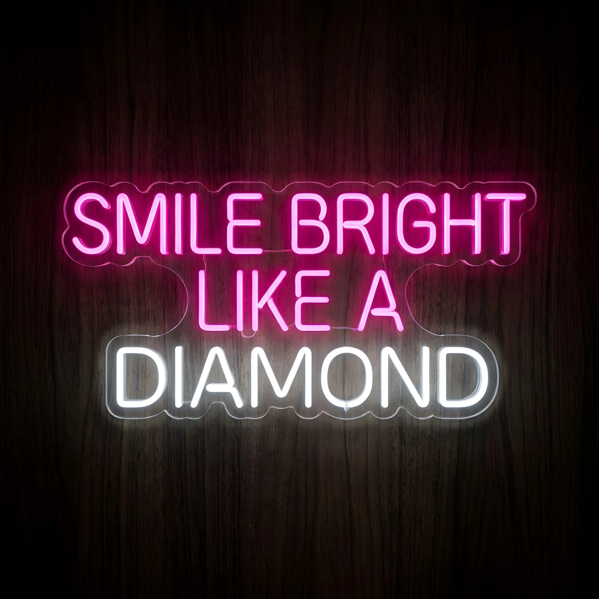 Smile Bright Like a Diamond LED neon sign featuring bright pink SMILE BRIGHT LIKE A lettering and cool white DIAMOND text on clear acrylic backing for dental clinic wall decor.