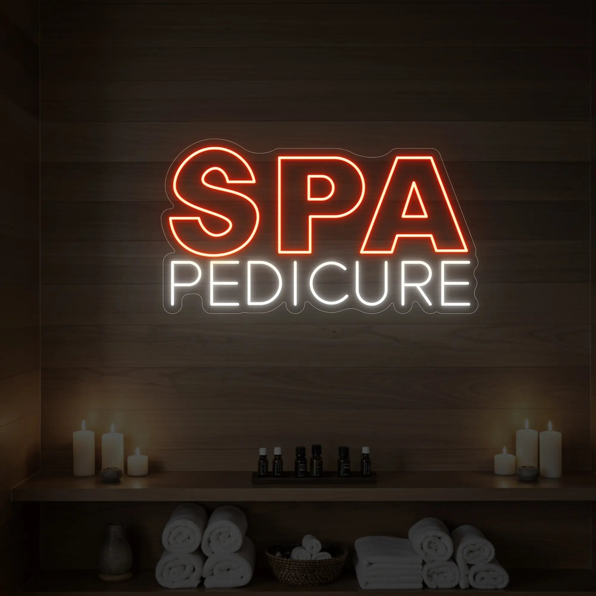 Photo of the 'Spa Pedicure' neon sign glowing in golden yellow against a styled interior wall.