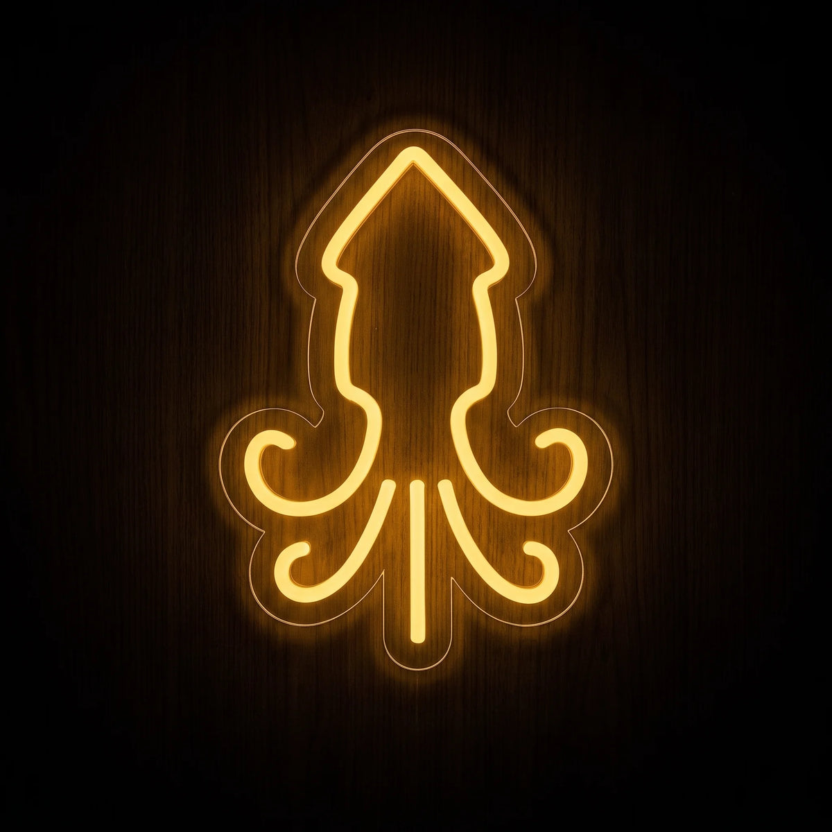 Squid Outline LED Neon Sign featuring a warm golden-yellow squid silhouette with curved tentacles on clear acrylic backing.