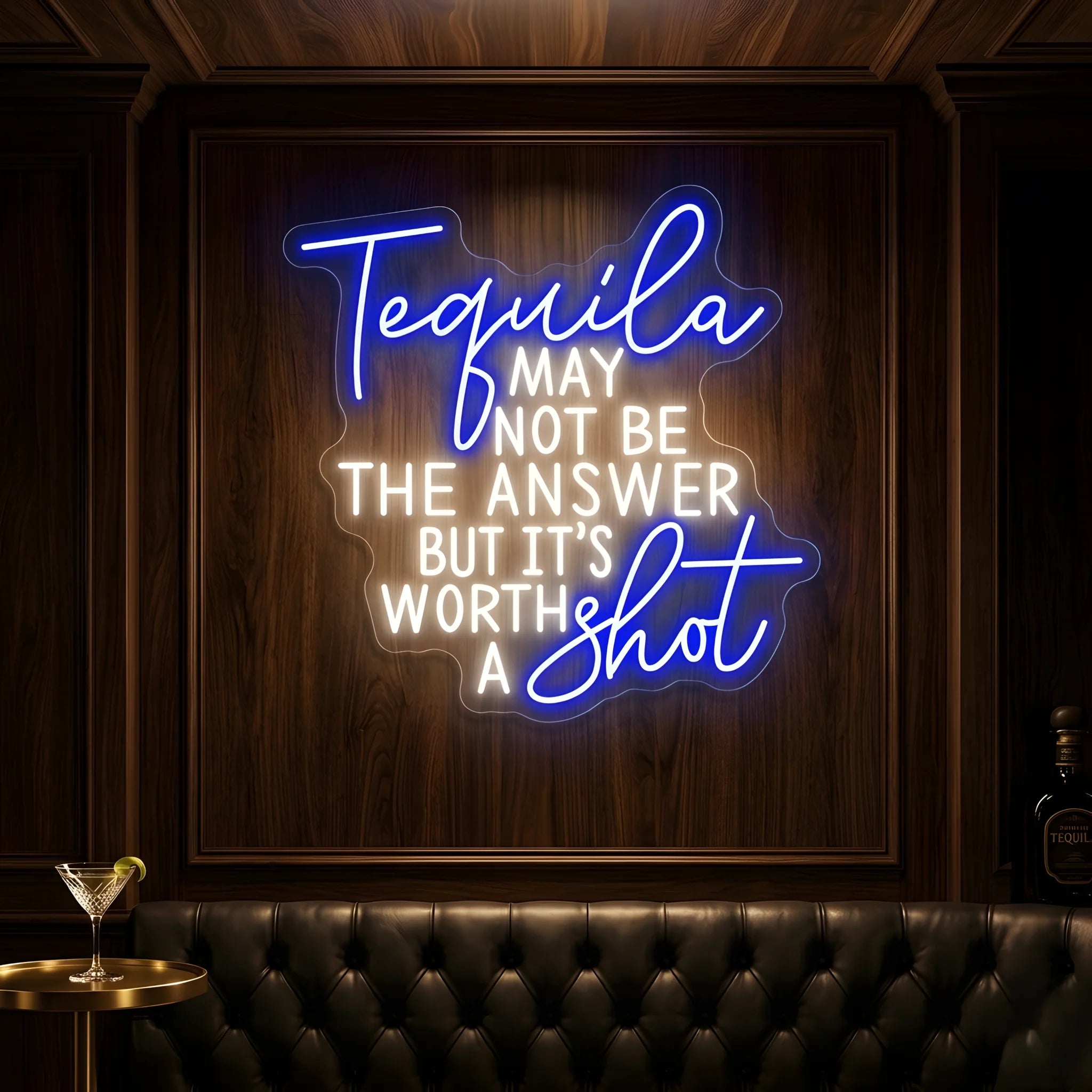 Photo of the 'Tequila May Not Be The Answer But It’s Worth a Shot' neon sign glowing in multi-color against a tequila bar-inspired wall.