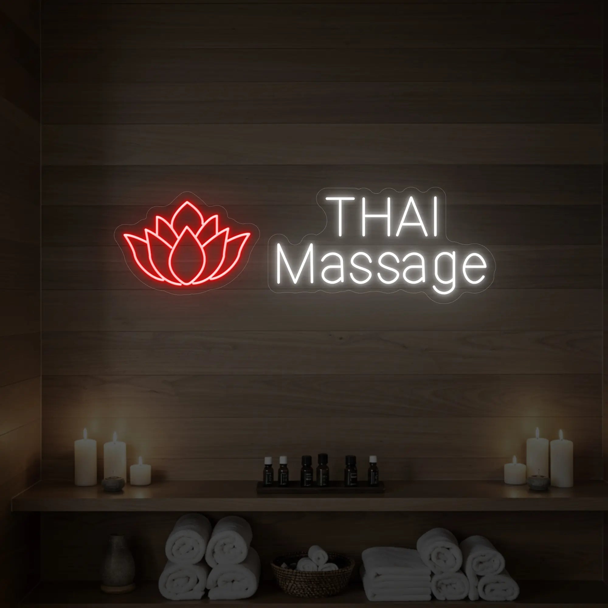 Photo of the 'Thai Massage' neon sign glowing in red against a styled interior wall.