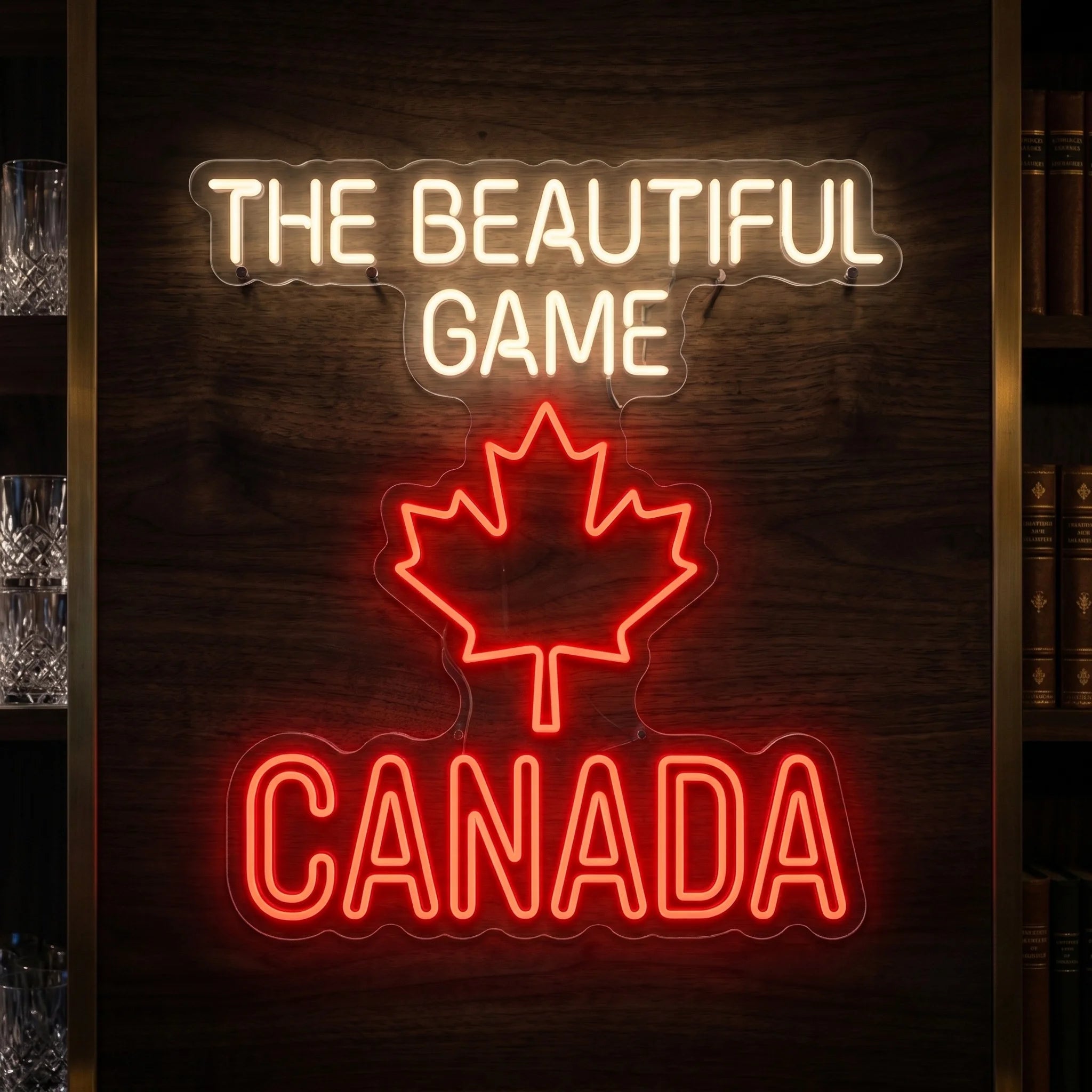 The Beautiful Game Canada LED neon sign featuring a red maple leaf with illuminated football-inspired typography