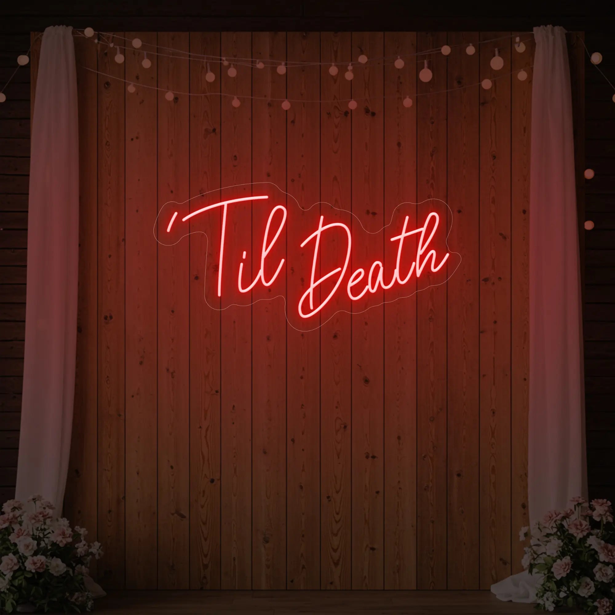 ''Til Death' neon sign glowing in red against a styled interior wall.