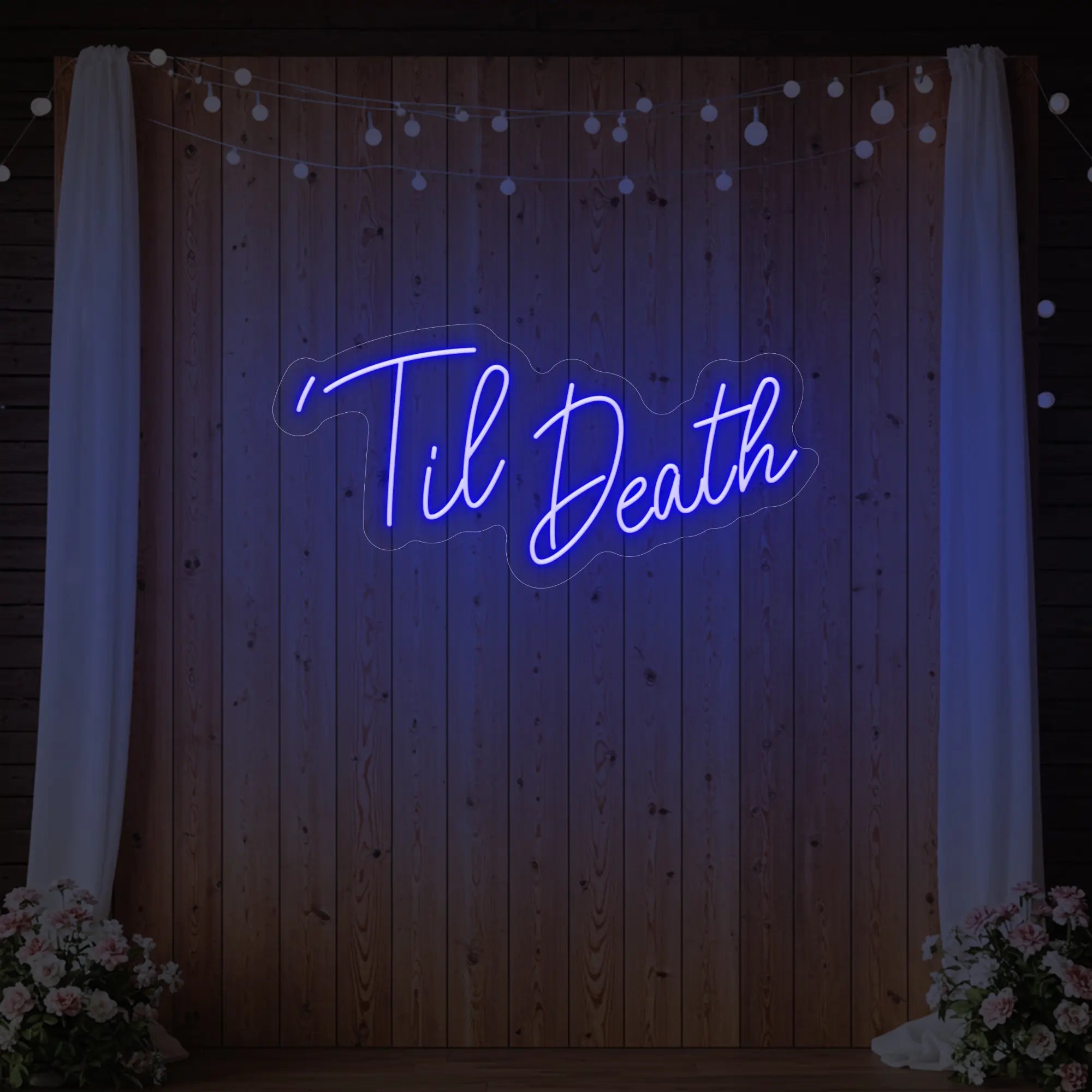 ''Til Death' neon sign glowing in deep blue against a styled interior wall.