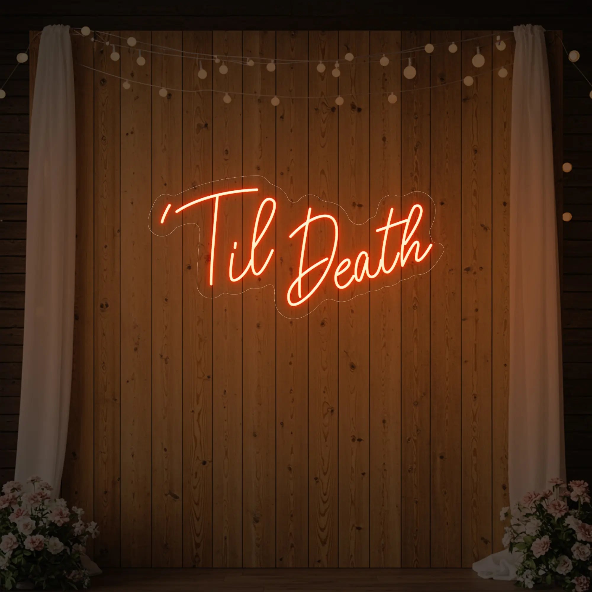 ''Til Death' neon sign glowing in golden yellow against a styled interior wall.
