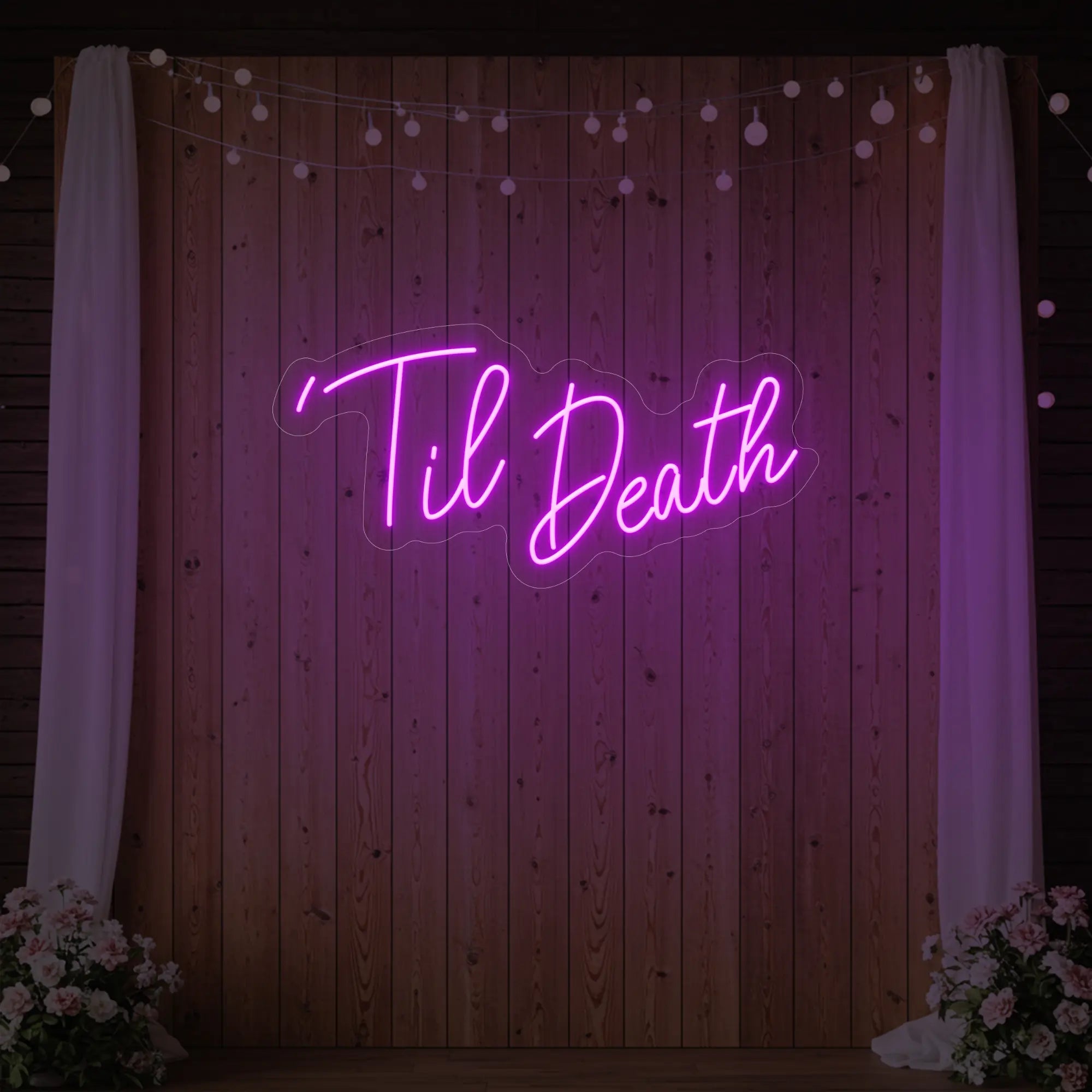 ''Til Death' neon sign glowing in light pink against a styled interior wall.