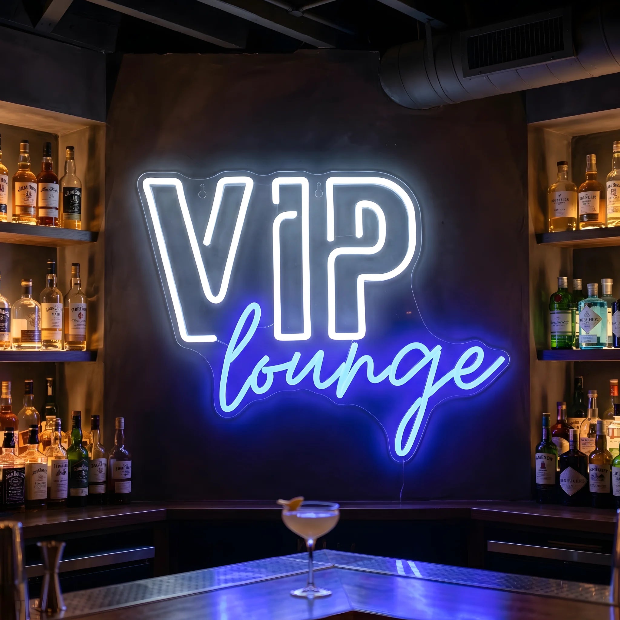 Photo of the 'VIP Lounge' neon sign glowing in multi-color against a luxury lounge-inspired wall.