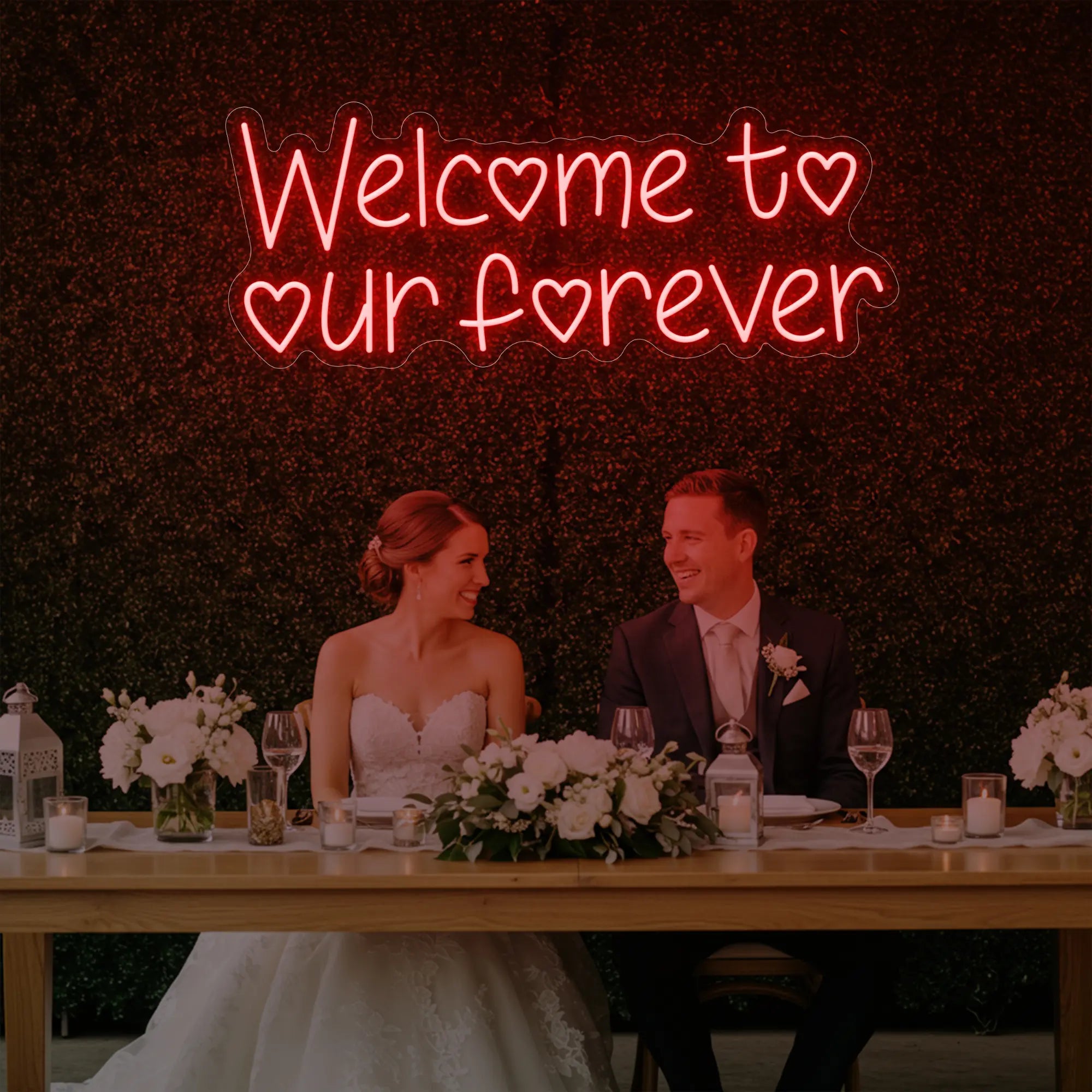 'Welcome To Our Forever' neon sign glowing in red against a styled interior wall.