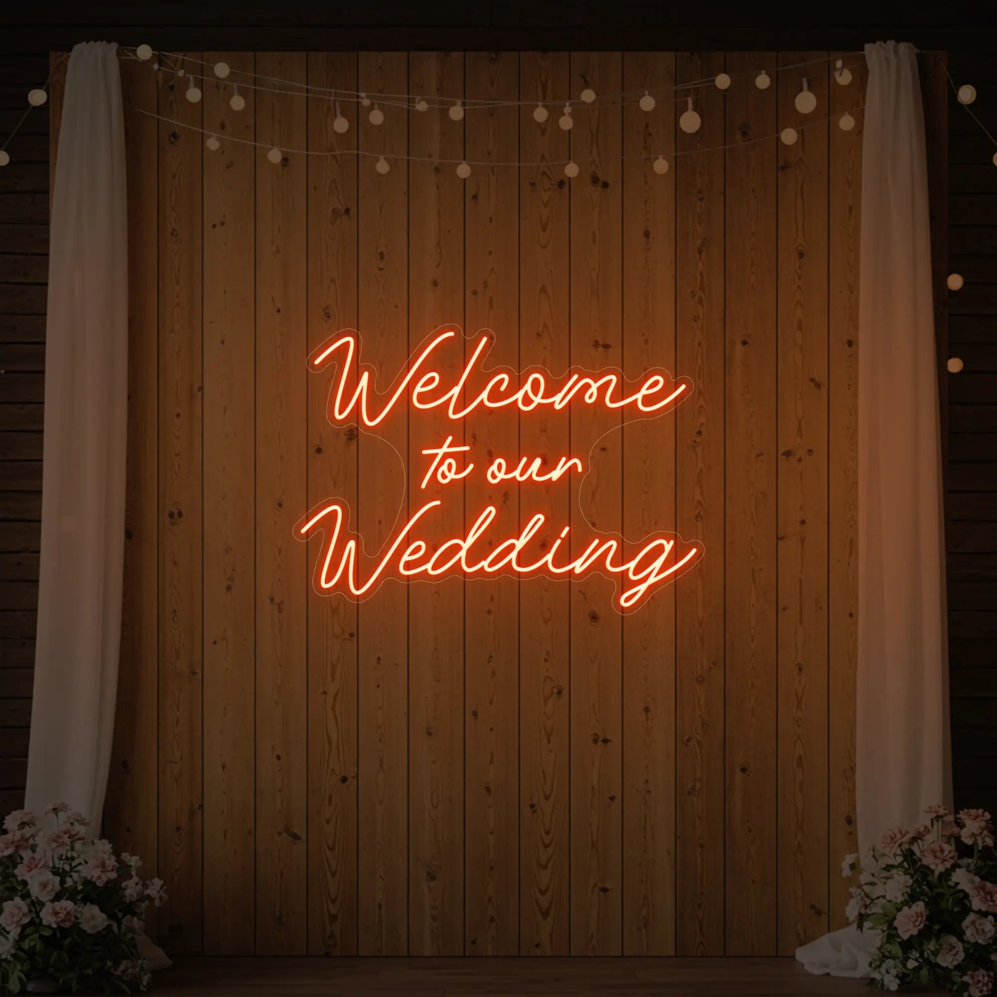 'Welcome To Our Wedding' neon sign glowing in golden yellow against a styled interior wall.