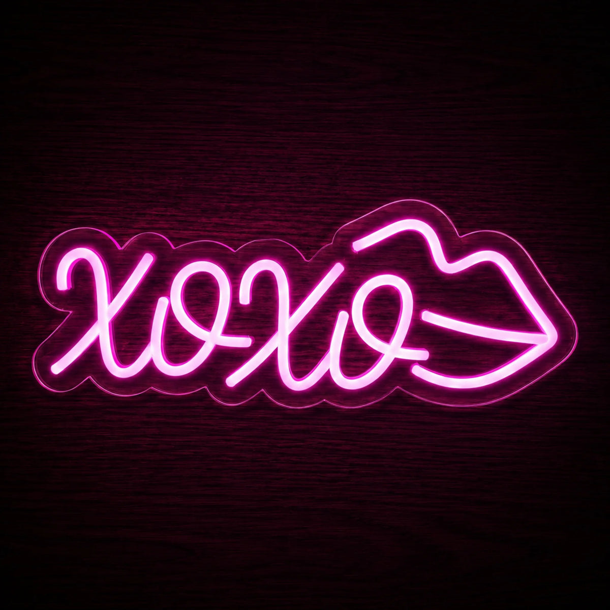 XOXO Lips LED Neon Sign featuring bright pink XOXO lettering and a lips outline on clear acrylic backing.