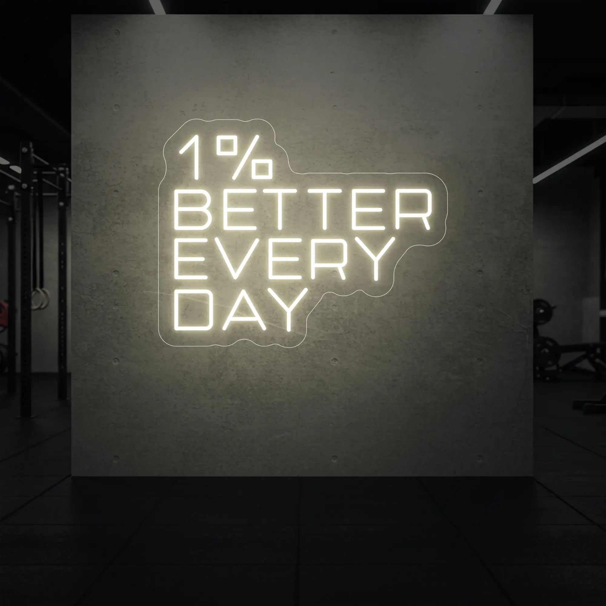 '1% Better Every Day' neon sign glowing in warm white against a styled interior wall.