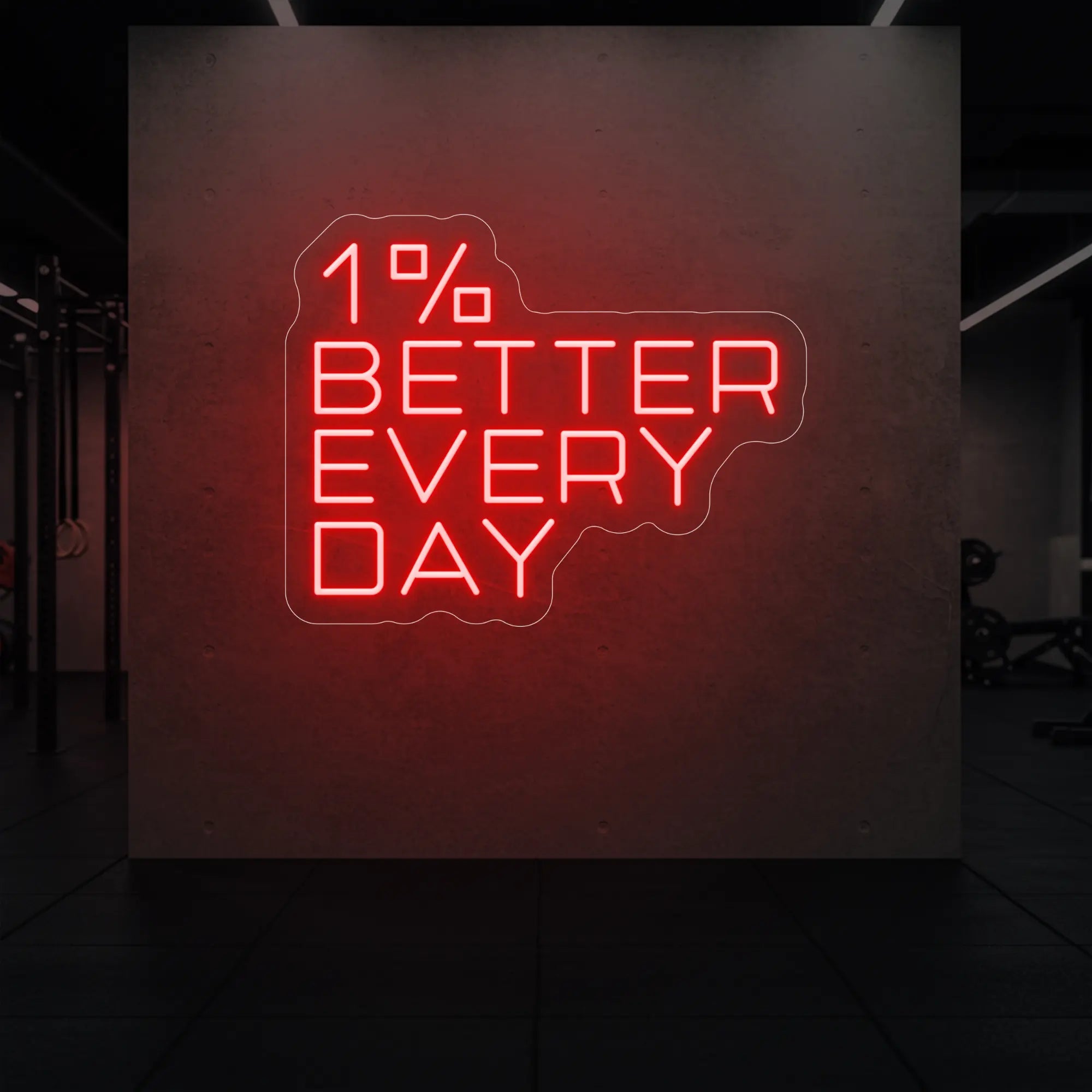'1% Better Every Day' neon sign glowing in red against a styled interior wall.