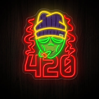 420 Street Vibes LED neon sign featuring a street-style character wearing a beanie above glowing 420 numbers in vibrant multicolor LEDs on a clear acrylic backing.
