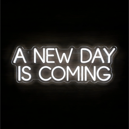 “A NEW DAY IS COMING” LED Neon Sign glowing in bright white uppercase letters across two lines on clear acrylic against a dark wood background, suited to bedrooms and home offices.