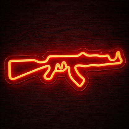 AK-47 Rifle LED Neon Sign featuring a bright orange-red rifle outline mounted on clear acrylic backing.