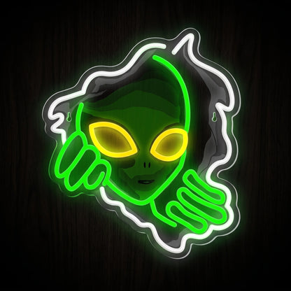 Alien Peek LED Neon Sign featuring a green alien peeking through an opening with yellow eyes and bright white accents.