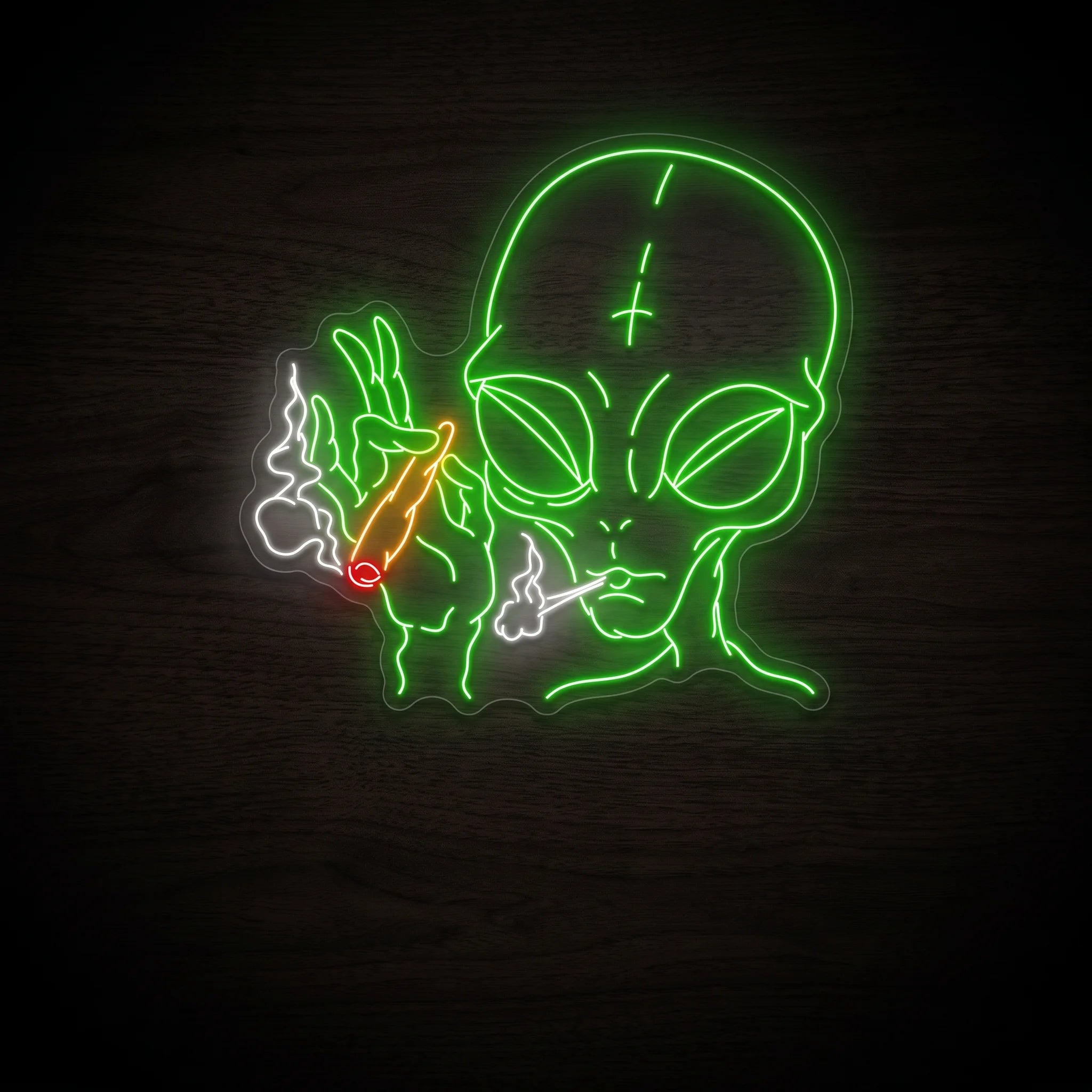 Green alien LED neon sign holding an orange joint with red tip and white smoke on clear acrylic backing for recreational wall décor.