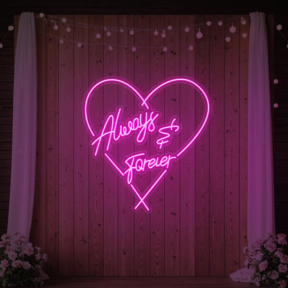 Photo of the 'Always & Forever' neon sign glowing in light pink against a styled interior wall.