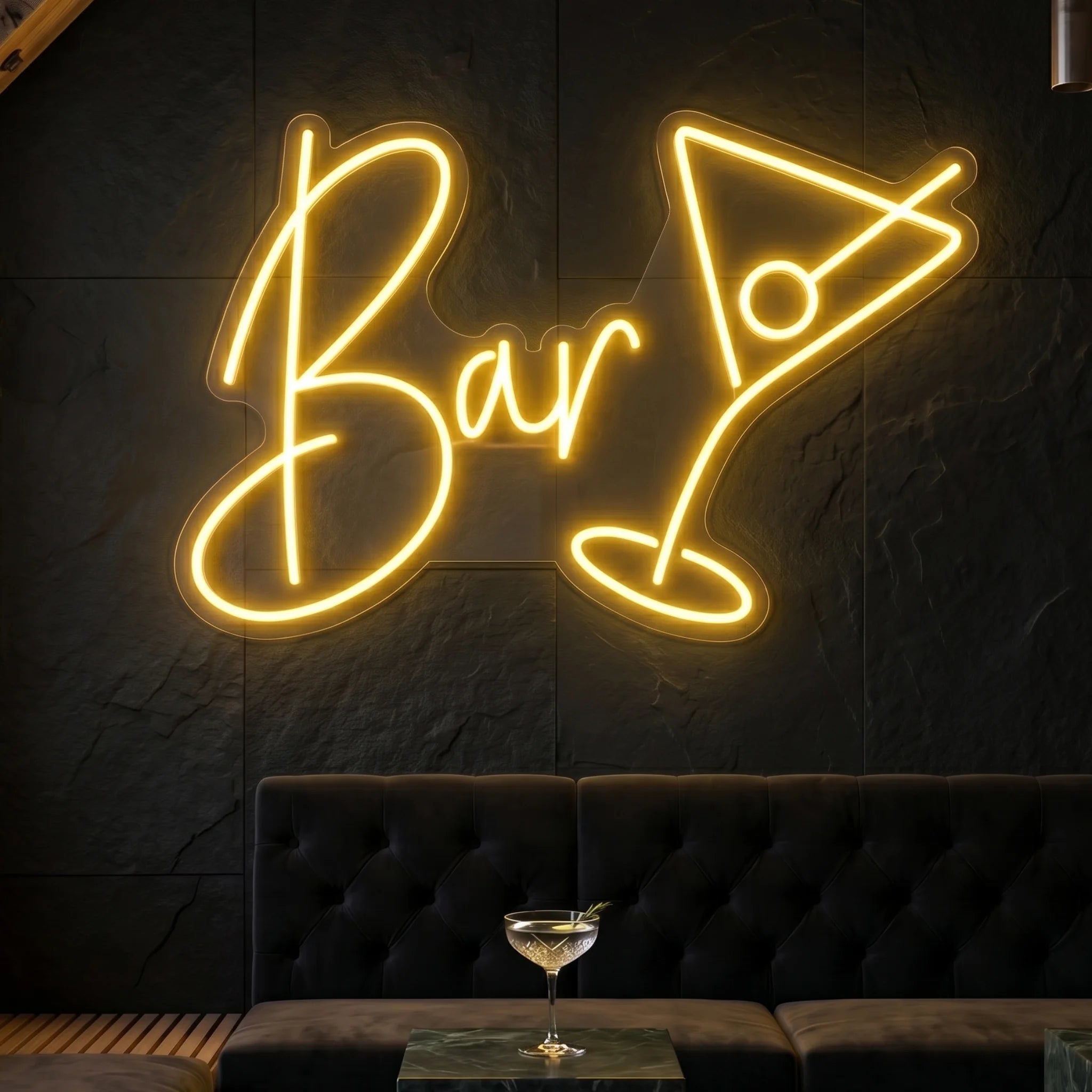 Photo of the 'BAR' neon sign glowing in warm white against a styled interior wall.