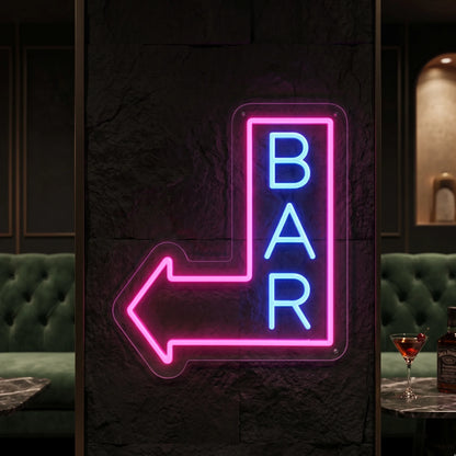 Photo of the 'BAR THIS WAY' neon sign glowing in ice blue and deep pink against a styled interior wall.
