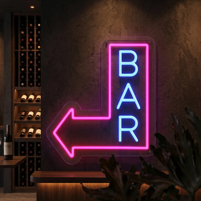 Photo of the 'BAR THIS WAY' neon sign glowing in ice blue and deep pink against a styled interior wall.