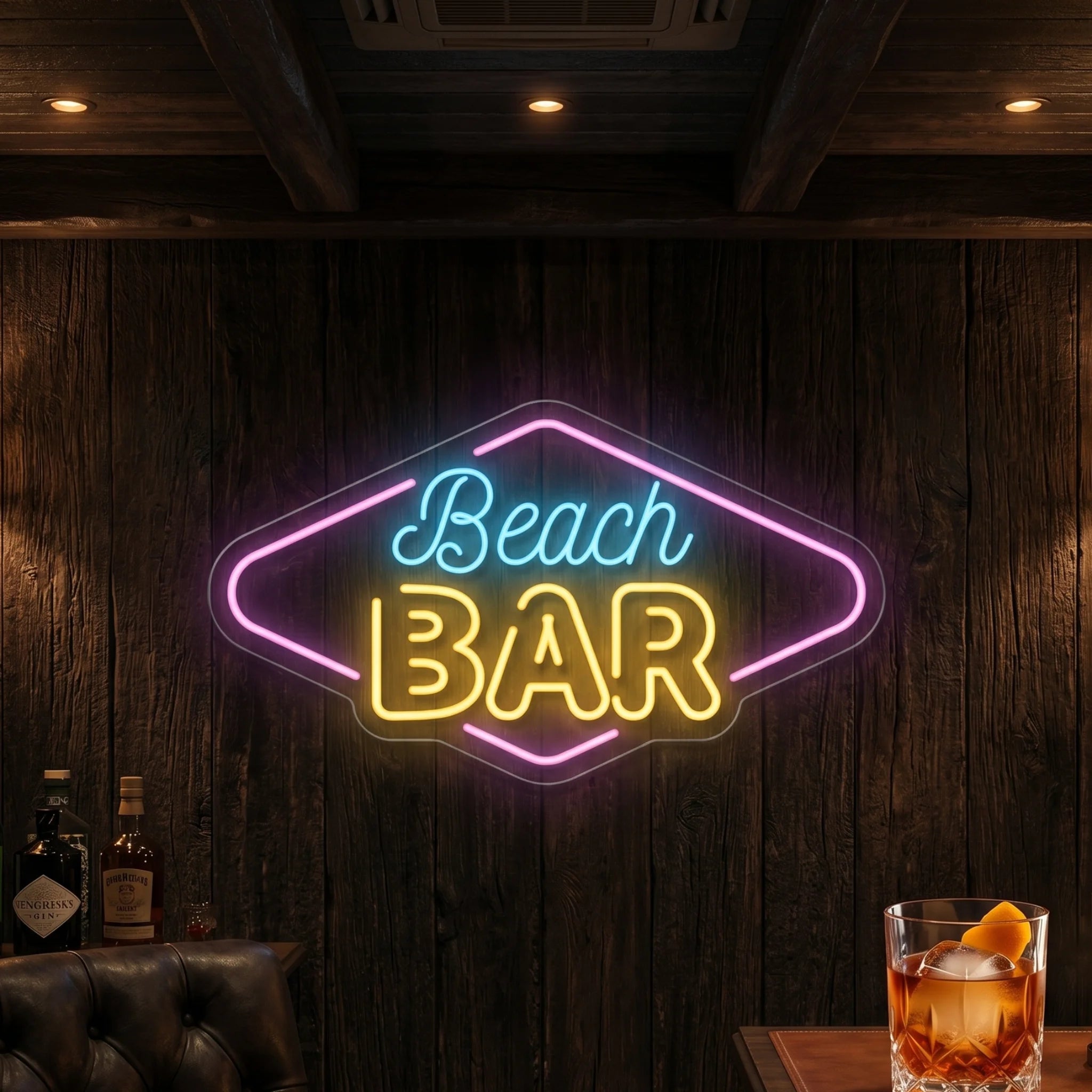 Photo of the 'BEACH BAR' neon sign glowing in ice blue, light pink and lemon yellow against a styled interior wall.
